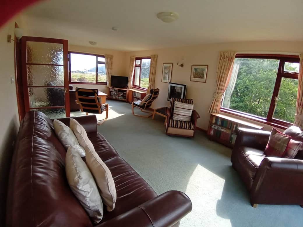 Lounge / Living Room.  Views to the sea at the front and the waterfall at the back 
