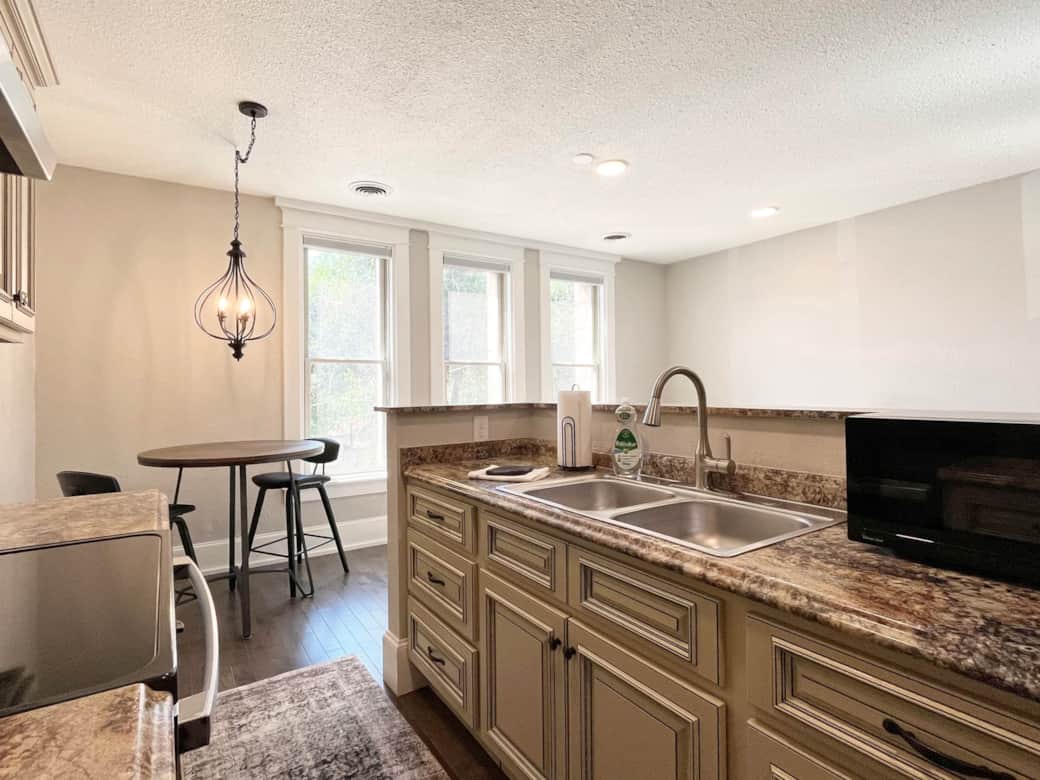 Microwave, full range oven, full-sized refrigerator, and combination K-cup/drip coffee maker.