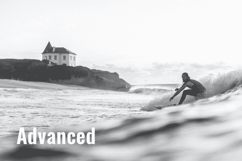 The image shows a surfer in a advanced surf school at Baleal Peniche Portugal