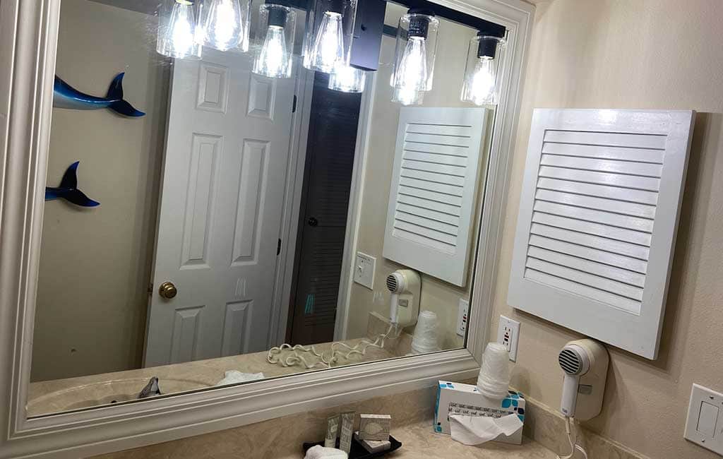 Large lighted mirror, toiletries & hairdryer.