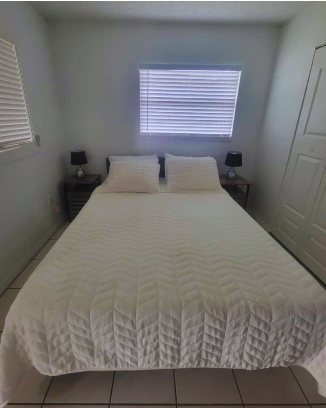 Comfortable queen bed with premium linens and nightstands. Lakeland, FL