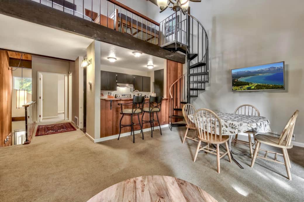 View of Kitchen and spiral staircase to 3rd floor loft