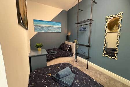 Twin room featuring original artworks and bespoke furniture