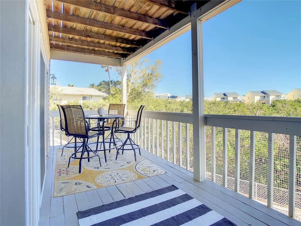 Private balcony at Gulf Coast 107 offering views of the mangroves and a peek of the Gulf
