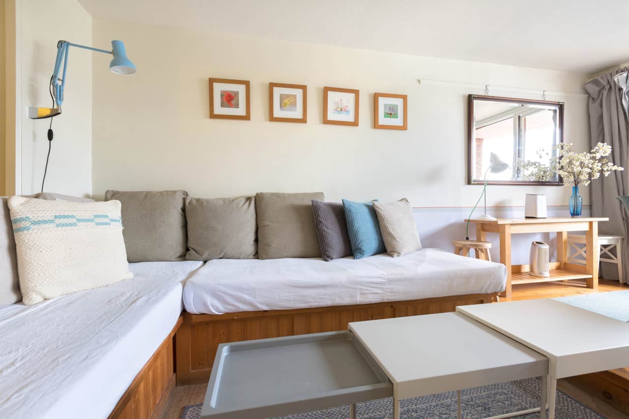 Soft cushions and artwork create a relaxed spot to unwind