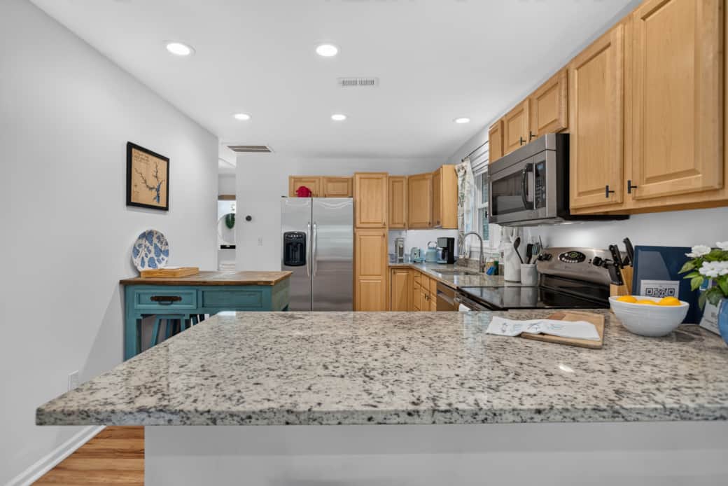 The kitchen island adds space for sitting and serving