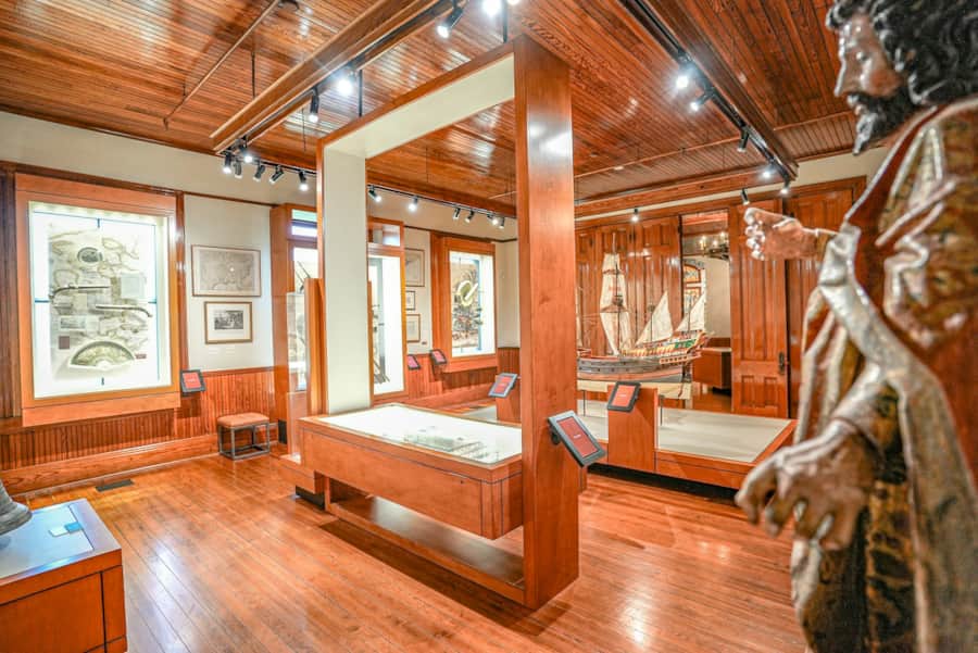 Visitors exploring historic art and cultural exhibits at The Bryan Museum