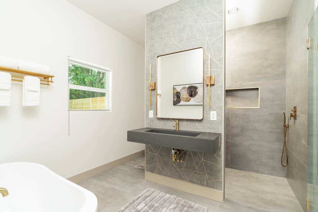 Ultra modern master bathroom with walk in rain shower, floating sink/toilet and standalone tub. Ultra modern master bathroom with walk in rain shower, floating sink/toilet and standalone tub.