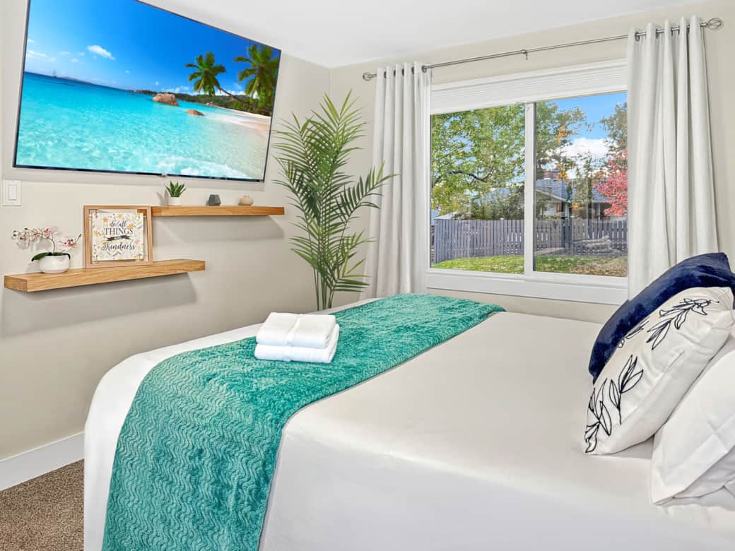 Bright Bedroom with Large Window and Smart TV, v2