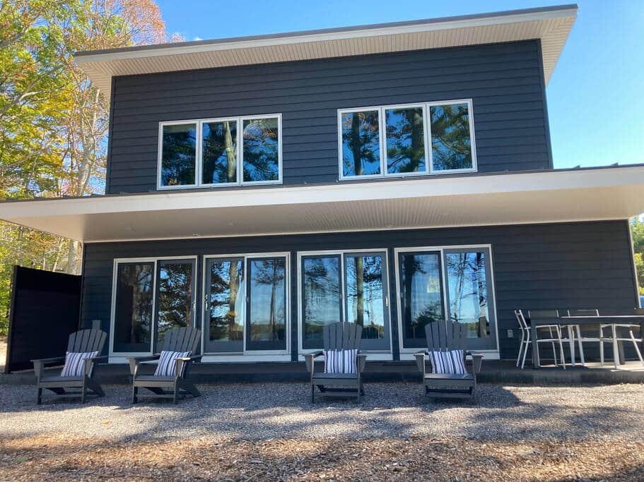 View of the water-side of the cottage, and it's many windows View of the water-side of the cottage, and it's many windows
