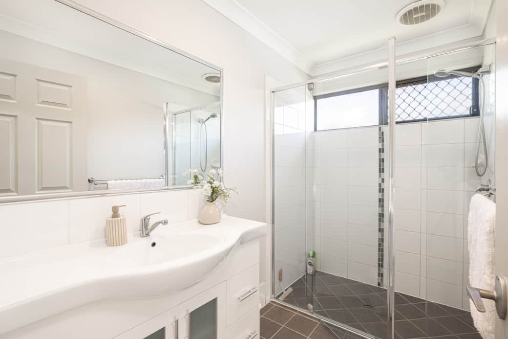 Bathroom: Stylish bathroom with walk-in shower, vanity, and clean finishes 