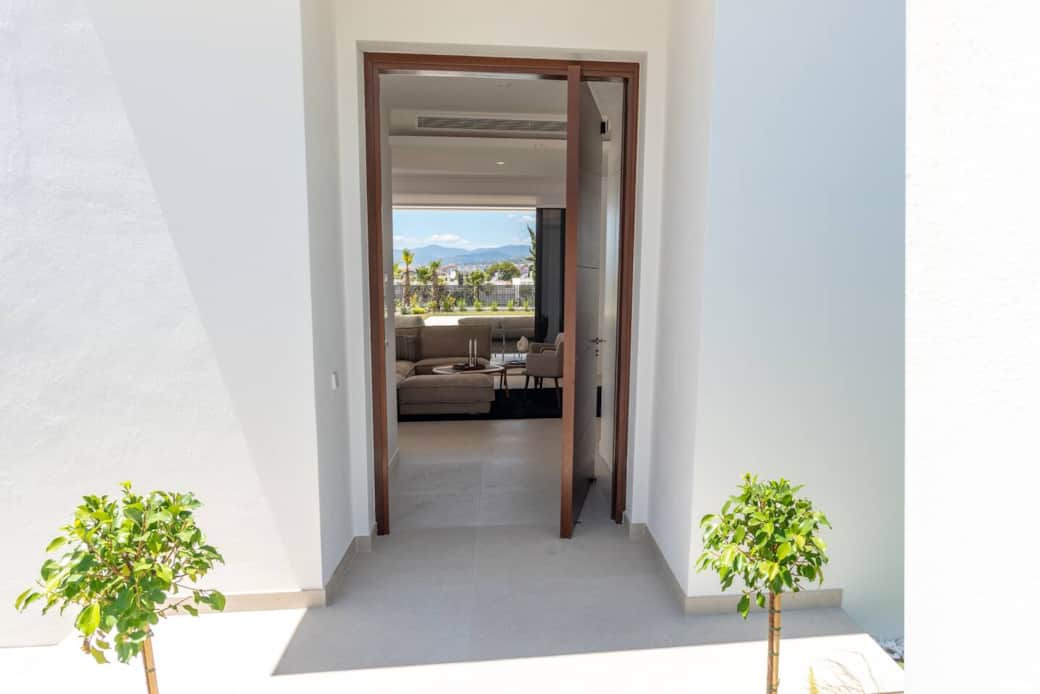 Entrance to the villa from front gate and carport 