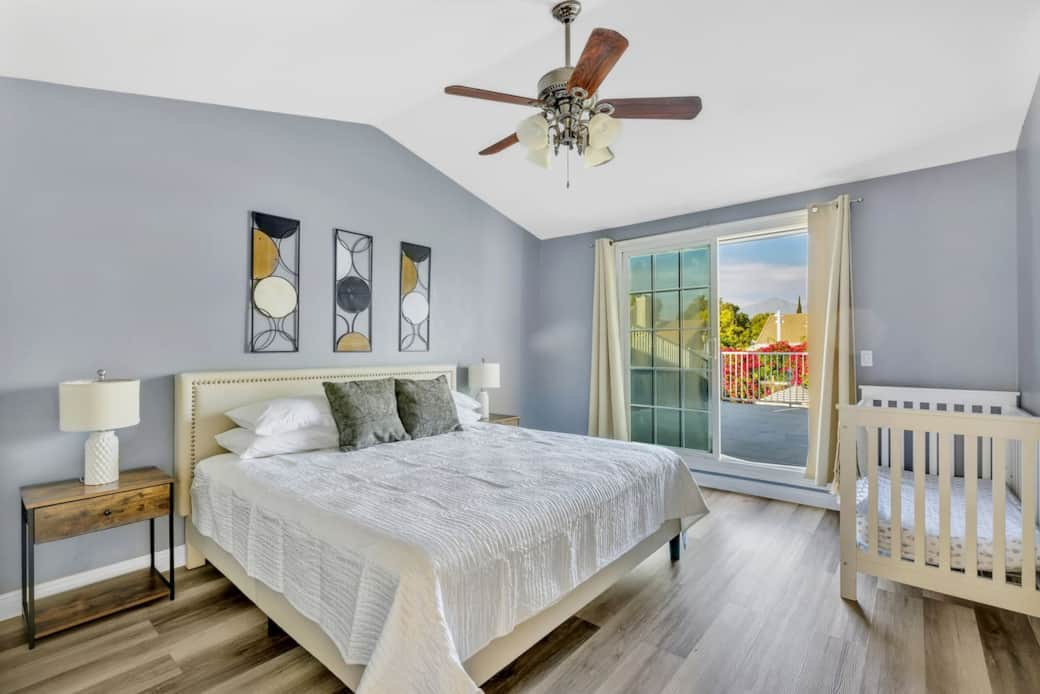 Primary suite with king bed, soft tones, and a calm space to unwind.