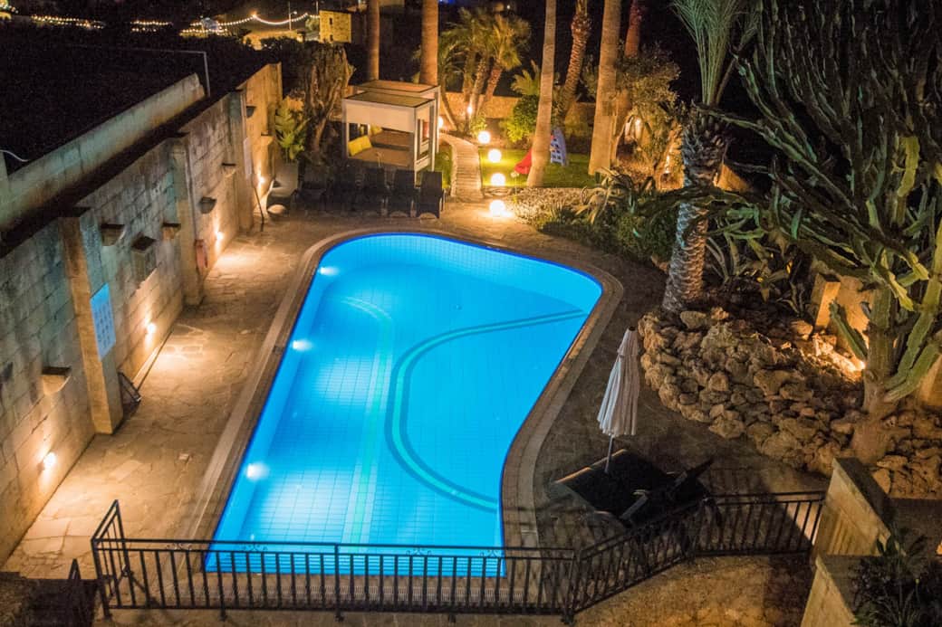 Outdoor Pool and Garden at night