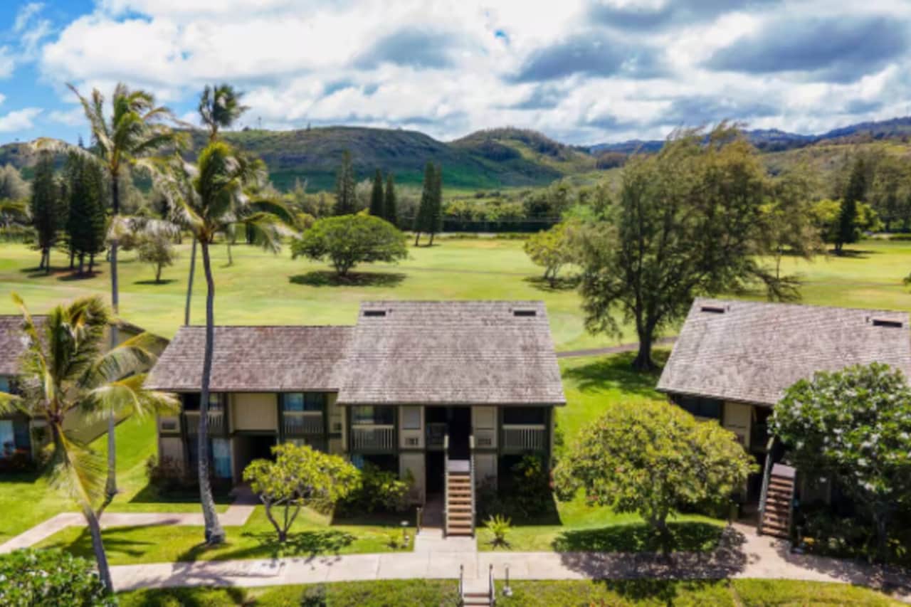 Your back yard is the Fazio Golf Course framed by the Hawaiian mountains. 