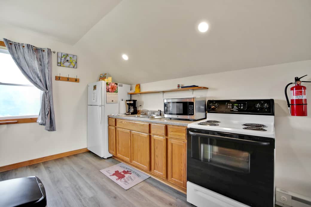 Efficiency kitchen, coffee pot with basket filter, electric range. 