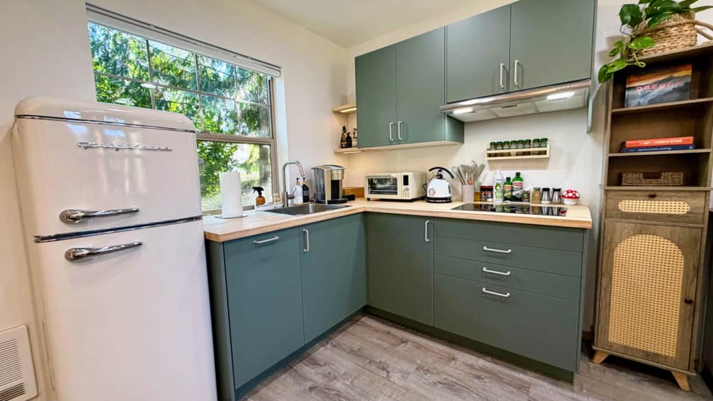 The fully stocked kitchen comes with all essentials, a dishwasher, coffee and tea, and spices.