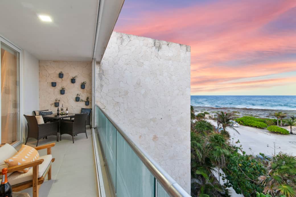 Balcony with seating for four and stunning Caribbean Sea views.