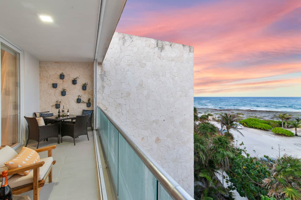 Balcony with seating for four and stunning Caribbean Sea views.