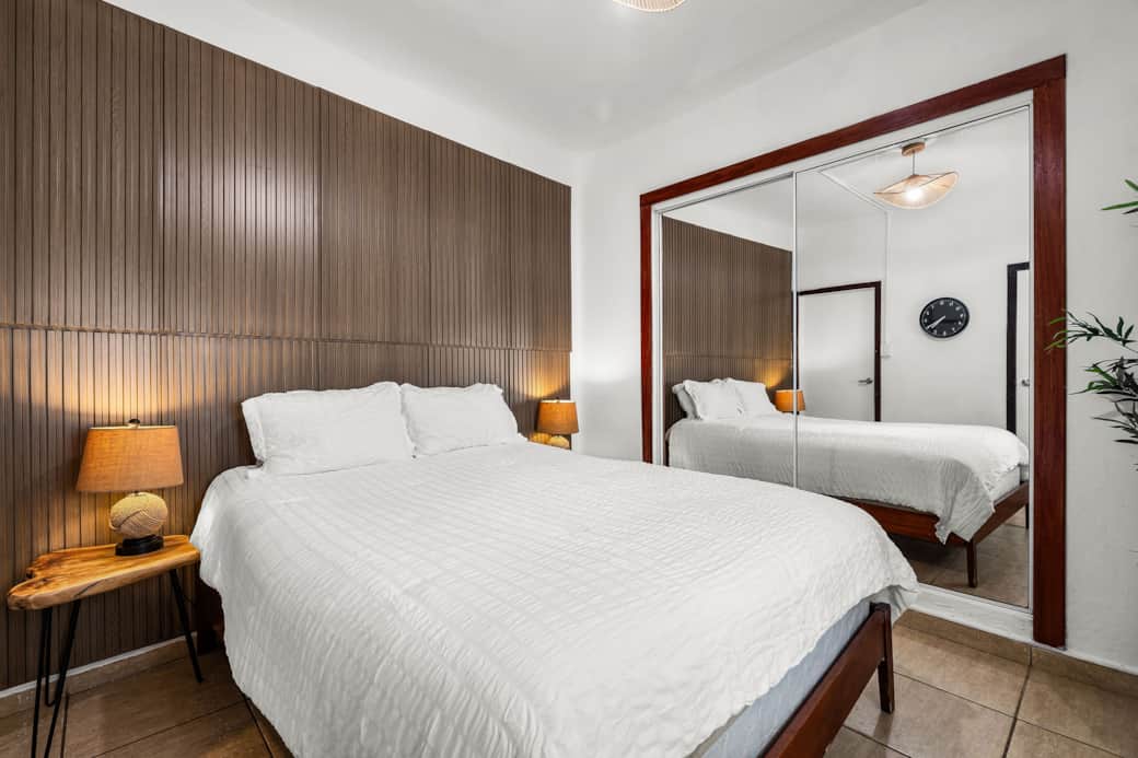 Comfortable queen bedroom with ample storage