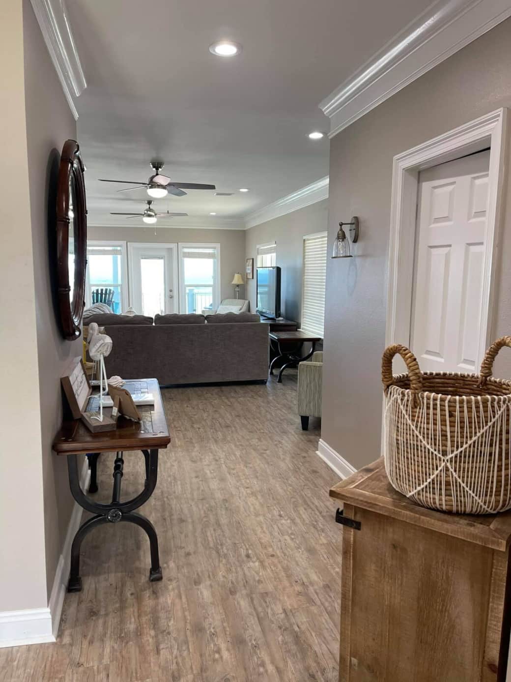 Hallway leading to living room.  The half bathroom for this level is on the right here through this door. 