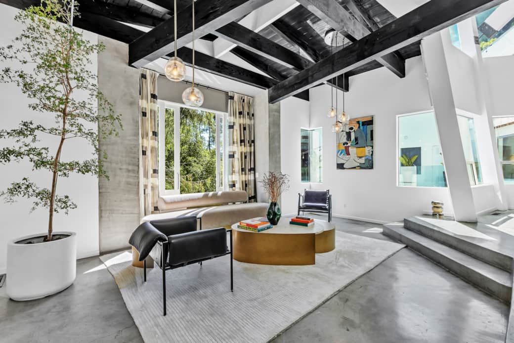 Savor the beauty of our living room's design, a harmonious blend of aesthetics and spaciousness.
