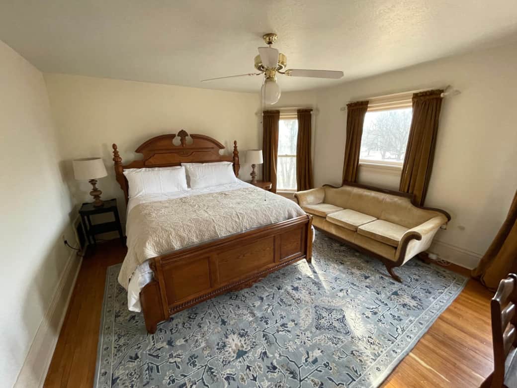 Upstairs king room with couch. Upstairs king room with couch.