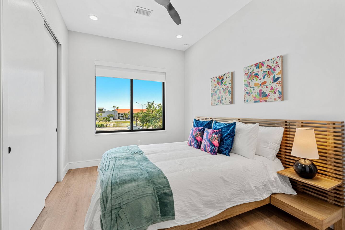 Wake up to natural light and exterior views, in bedroom 7, featuring a queen size bed.