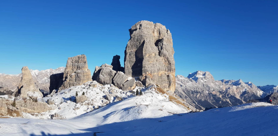 Skiers on snowy slopes in the Dolomites near Cortina