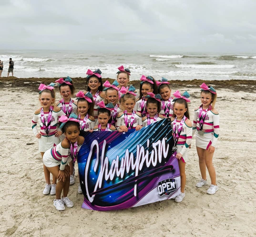 Cheer team celebrating Nationals in Galveston.