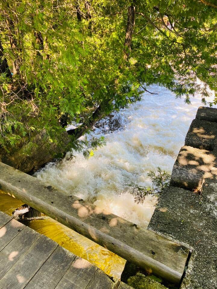 The private dam flowing downstream in the backyard.