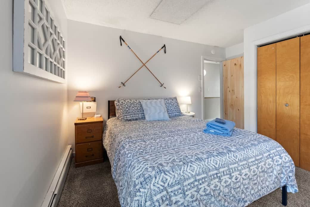 Closet and side tables with drawers for clothes and gear. Charging stations on side tables and work station.