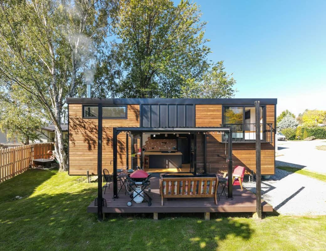 This 40m2 tiny home has many cool features including:  a tiny balcony to allow a big window in the bedroom,  a pergola with opening roof, full kitchen w. hot water tap, whine fridge, pot filler, smart voice controlled lighting, appliances and blinds.