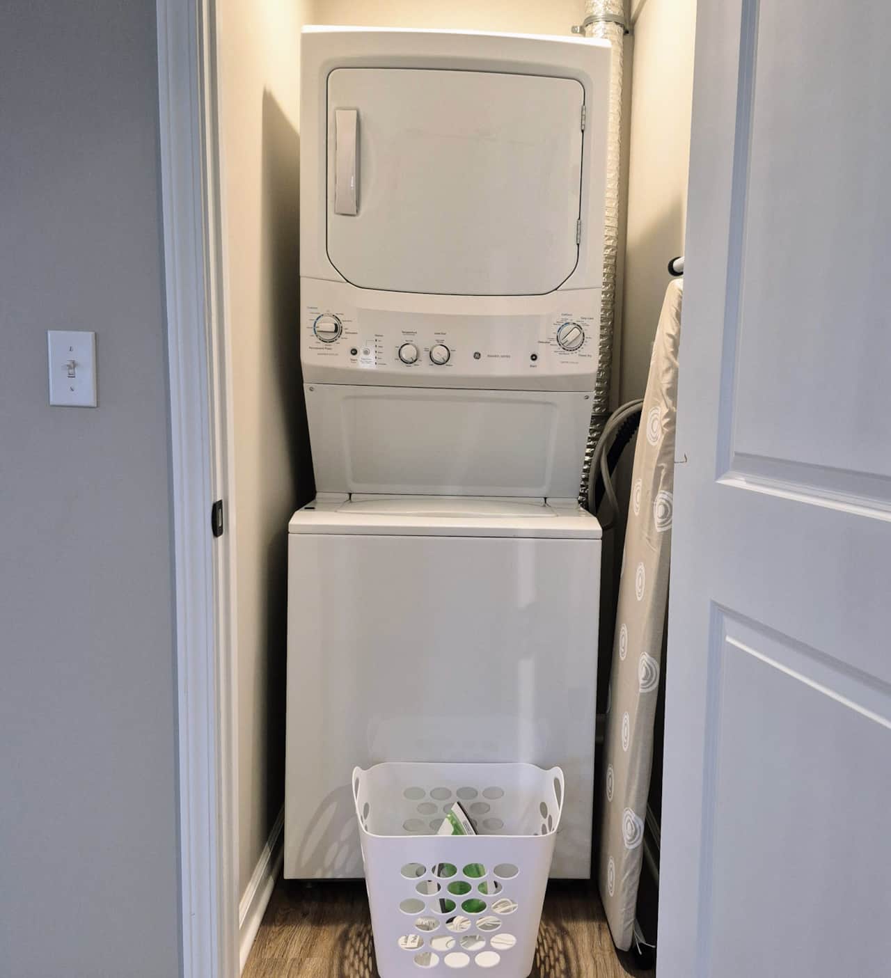 Laundry area with washer/dryer, iron and ironing board