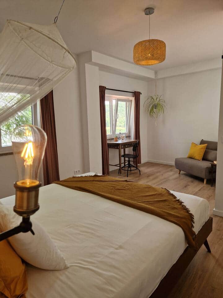 Barefoot Guesthouse Ericeira Spacious Valley room light coliving desk with view private bathroom kingsize bed and sofa Barefoot Guesthouse Ericeira Spacious Valley room light coliving desk with view private bathroom kingsize bed and sofa