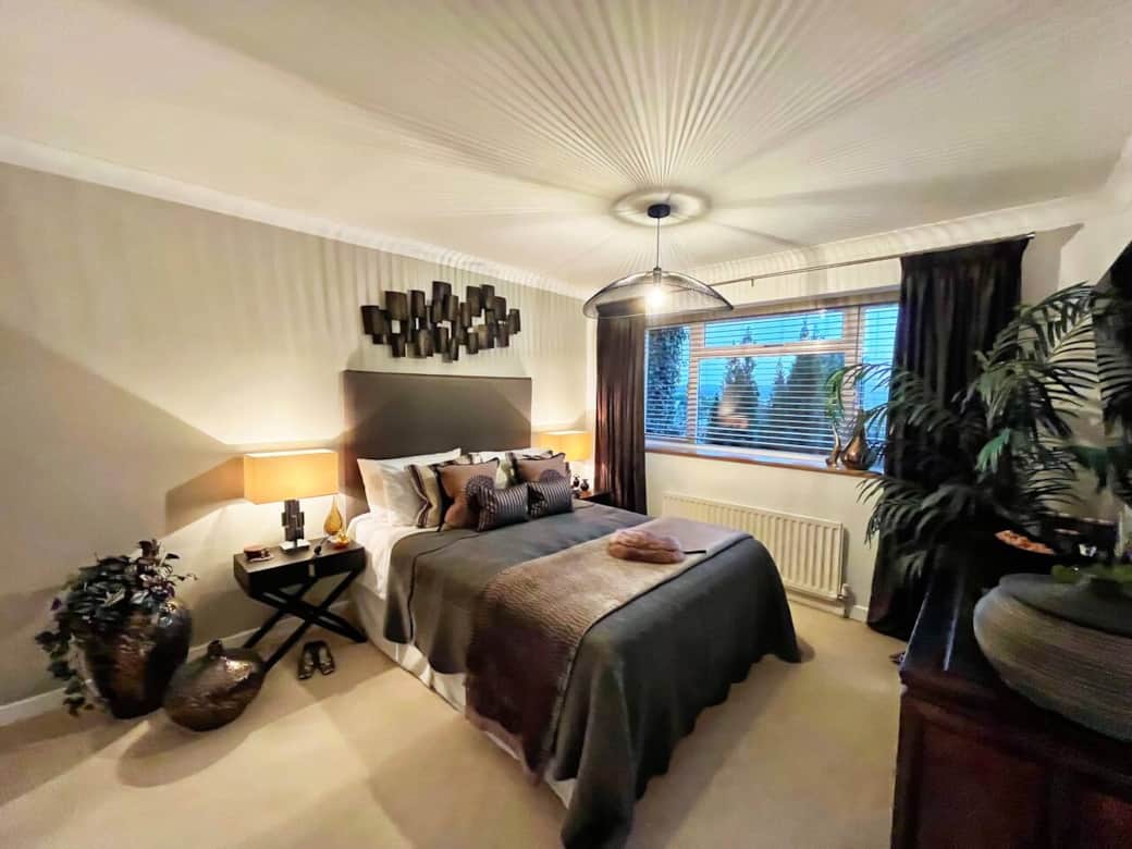 Serene Master Suite: Retreat to this stylish master bedroom featuring plush bedding, soft lighting, and sophisticated decor. Perfect for unwinding in comfort after a day of exploring. Equipped with TV, wardrobe and dressing unit & en-suite bathroom