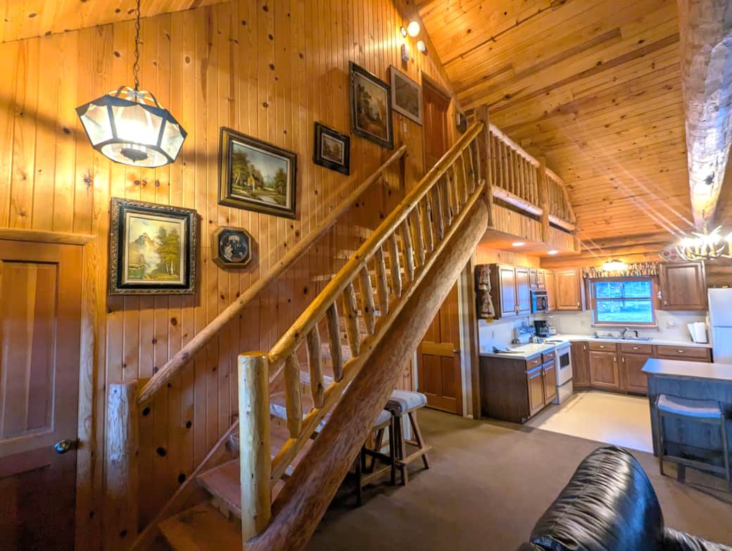 Log stairway to upper Bedroom