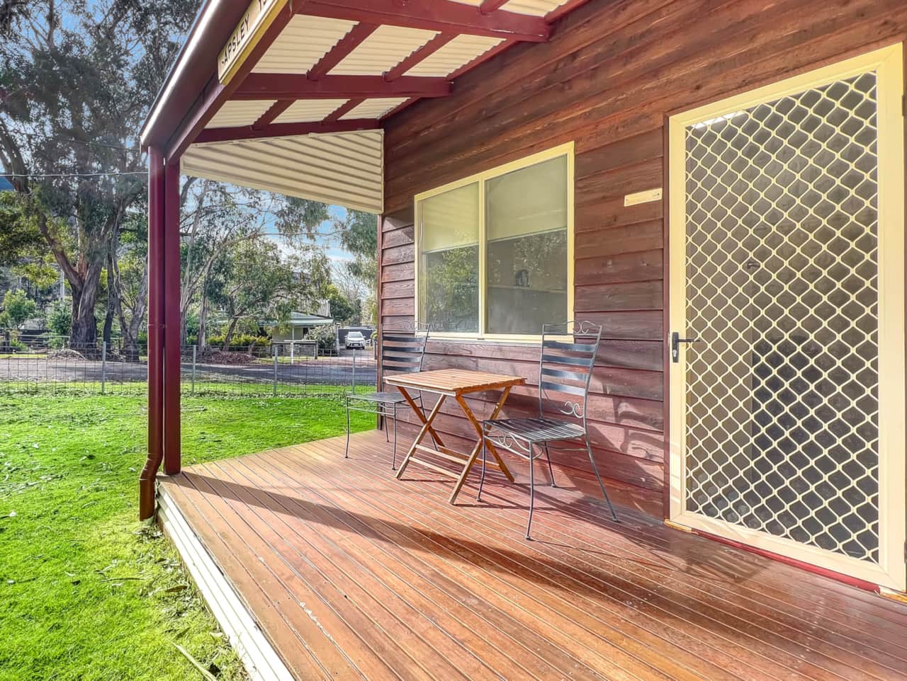 Relax on the charming front porch, perfect for soaking up the sun and unwinding.