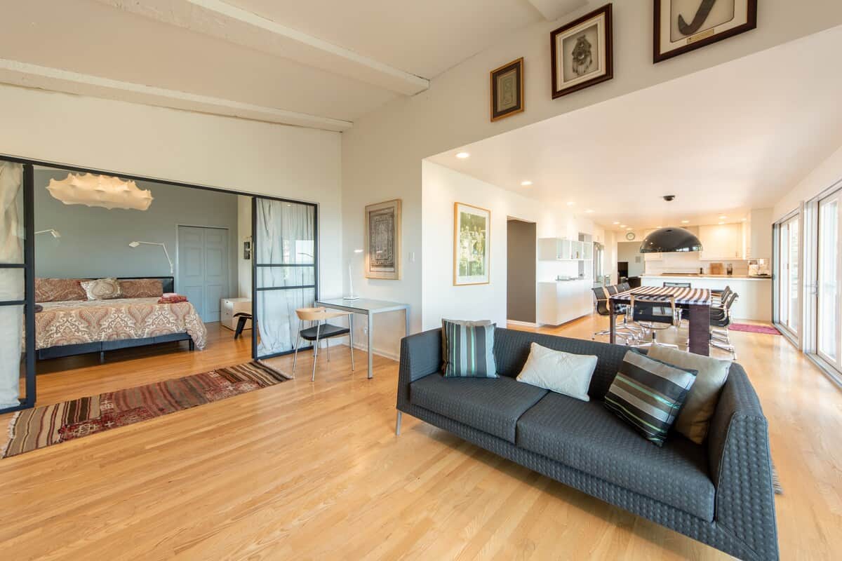 Ground floor  Owner's Suite with king bed, LED TV and designer lighting.