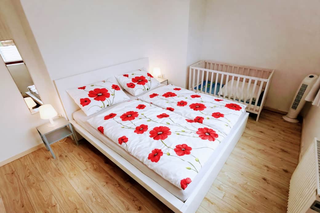 Sleeping Room 1 - King-size bed and baby bed