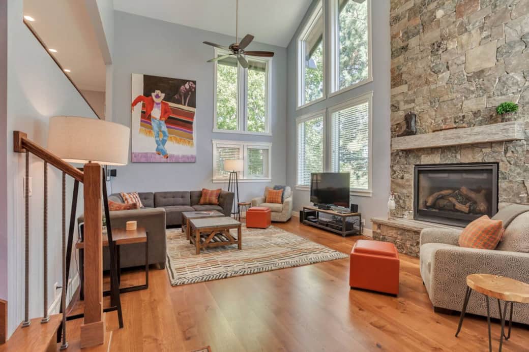 Elegant living room with high tech fireplace and surround sound.