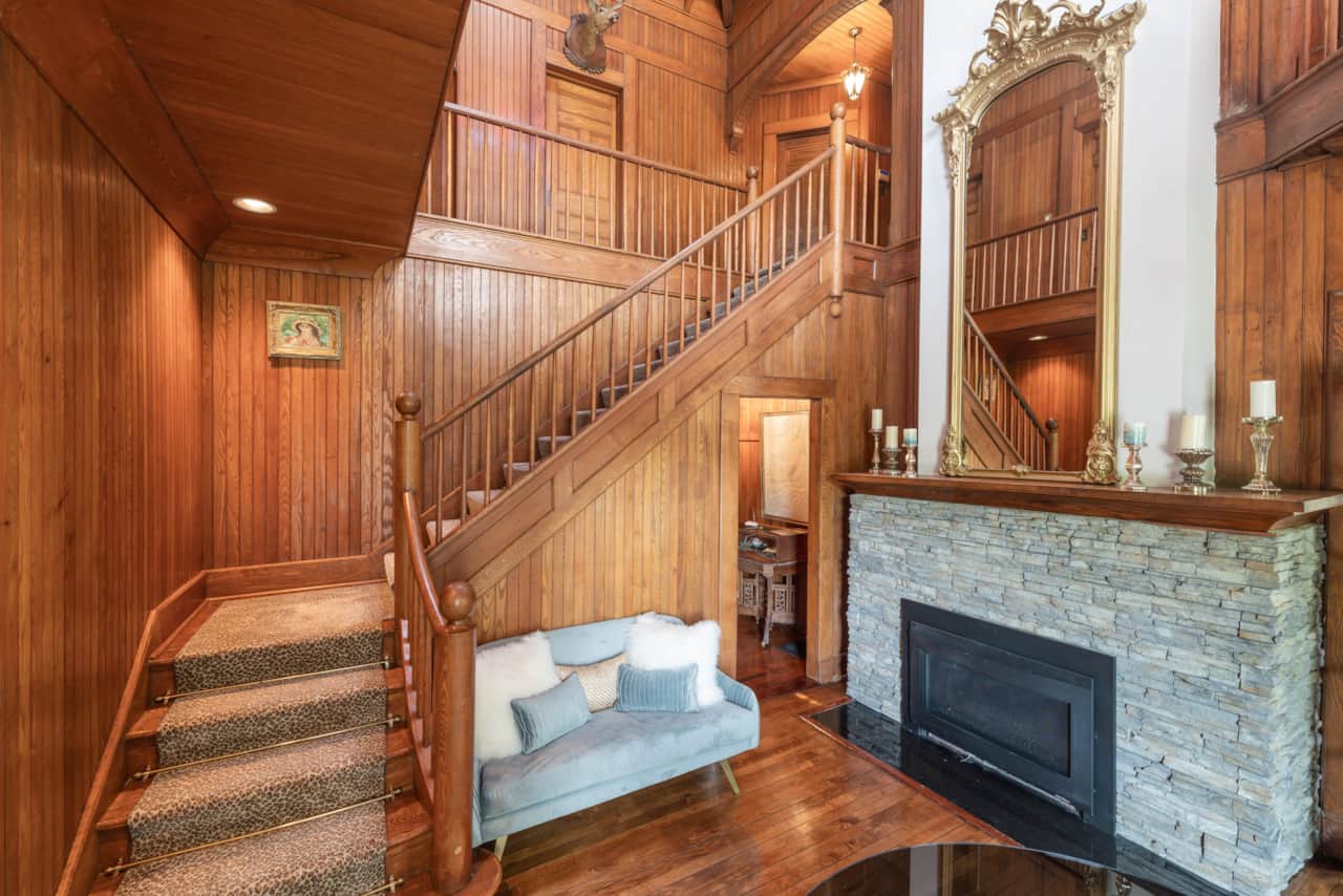 Historic triple height Foyer with Fireplace