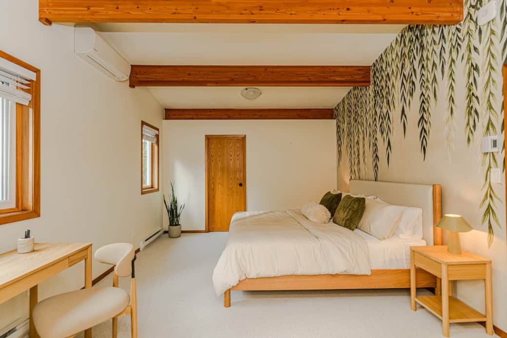 This tranquil primary suite, generously sized, invites complete relaxation. Featuring a vaulted ceiling, premium king bed, a dedicated workspace at the writing desk, and is illuminated by natural light. This tranquil primary suite, generously sized, invites complete relaxation. Featuring a vaulted ceiling, premium king bed, a dedicated workspace at the writing desk, and is illuminated by natural light.