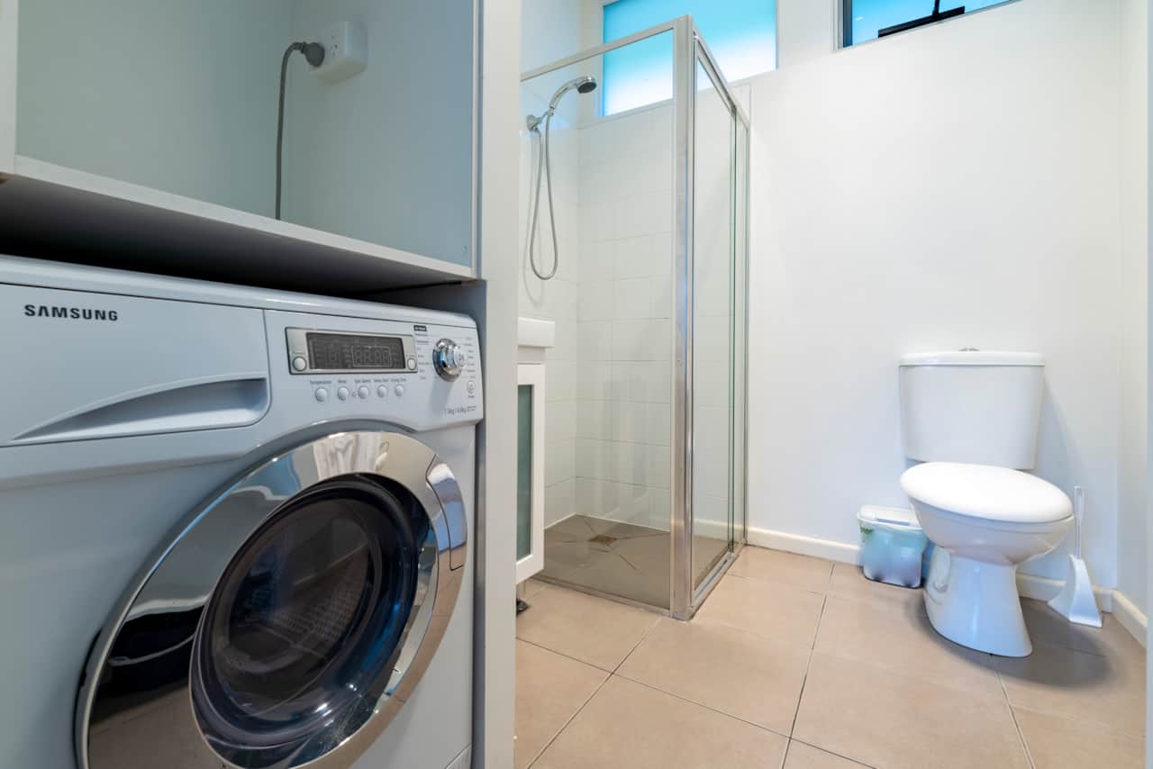 Studio Apartment Laundry and Bathroom 01