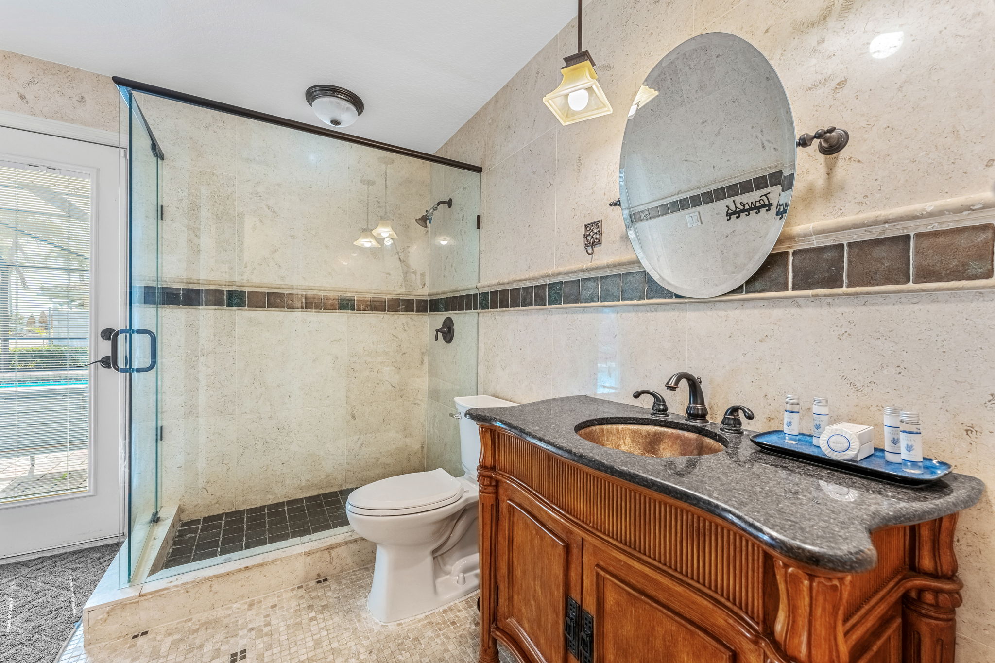 Experience the refreshing walk-in shower with modern fixtures and calming design.