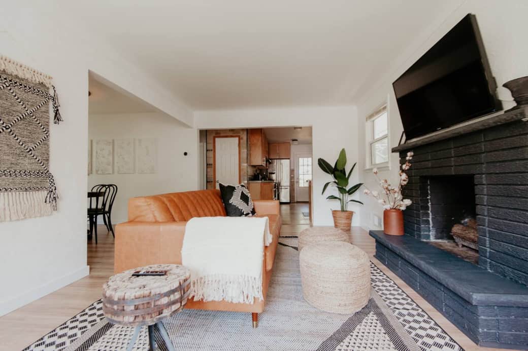 Open concept Living room with smart tv and leather couch
