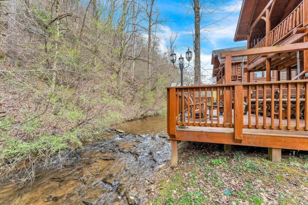 Escape to Creekside Dreams!  Unwind on the back deck, just steps from the creek—where the only soundtrack is the gentle flow of water and rustling leaves. A peaceful escape to recharge, reconnect, and breathe in nature.