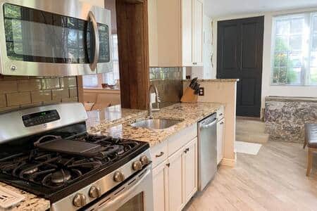 Full Kitchen with View of Entrance Into Unit