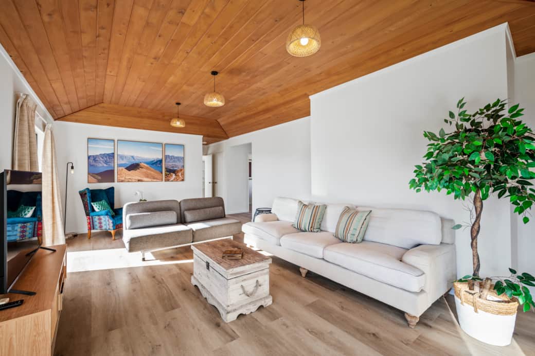 Spacious, sun-filled lounge with a comfy window seat (not shown) and a fold-out sofa.