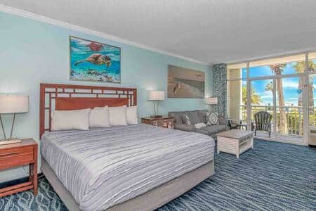 Living Area with Ocean Views & Walk-Out Patio Access  Enjoy stunning views from your sofa with a lar